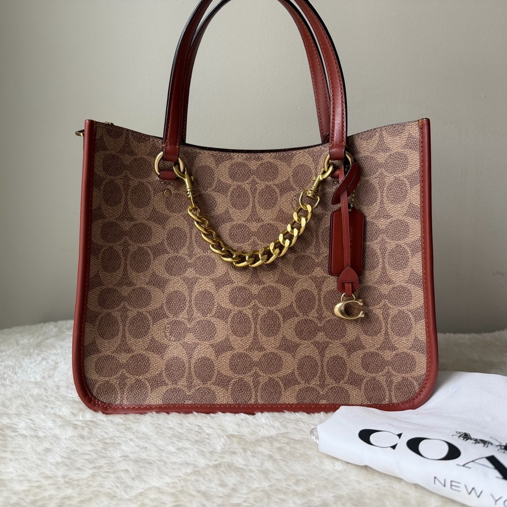 Coach Tyler Carryall bag 28 in brown with chain charm and dust bag